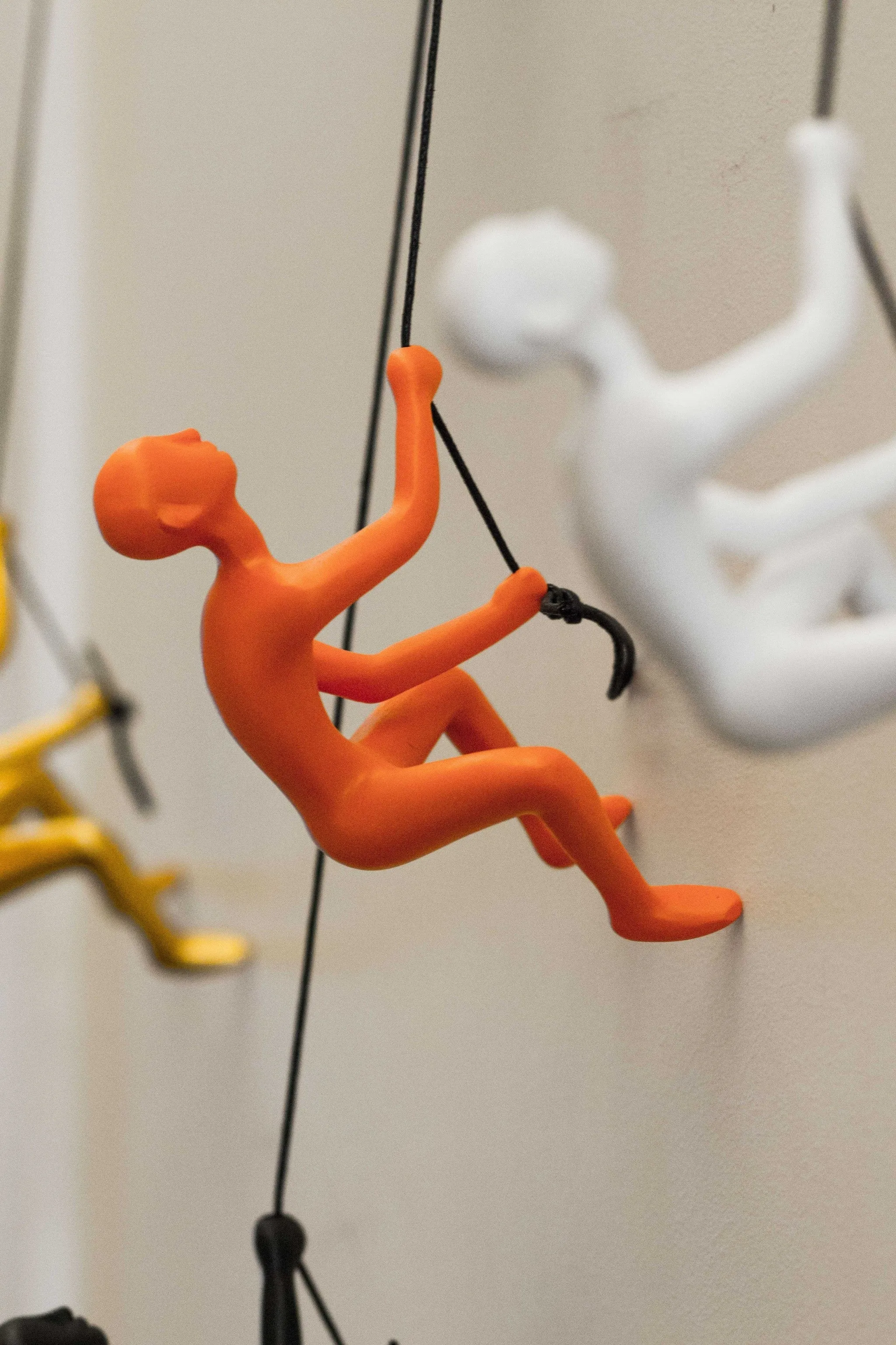 Unique Orange Climbing Man Wall Art | 3"x6"